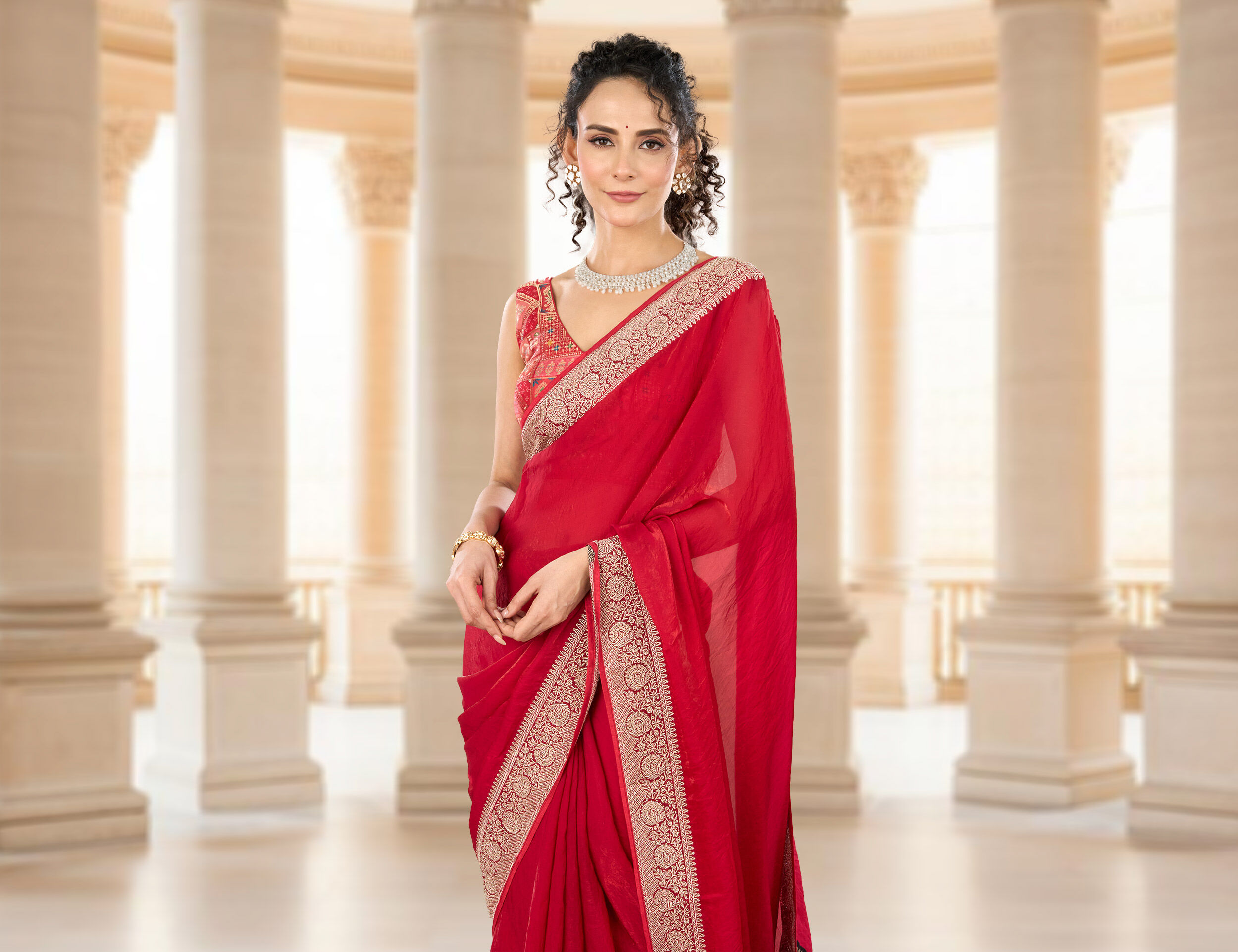 Women flaunting her beautifull red saree and matching jwellary